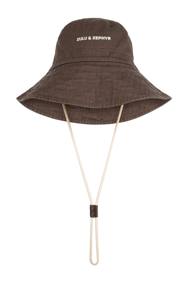 Brown bucket hat with a strap on a white background