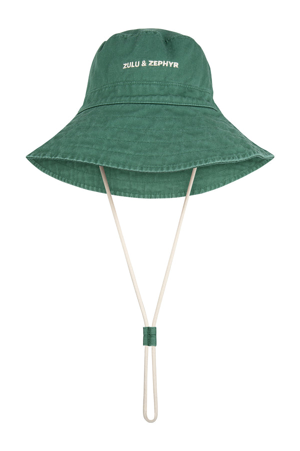 Green bucket hat with a strap on a white background