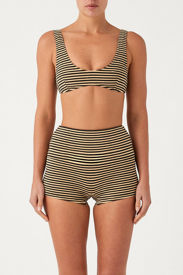 Person wearing a striped bikini set on a white background